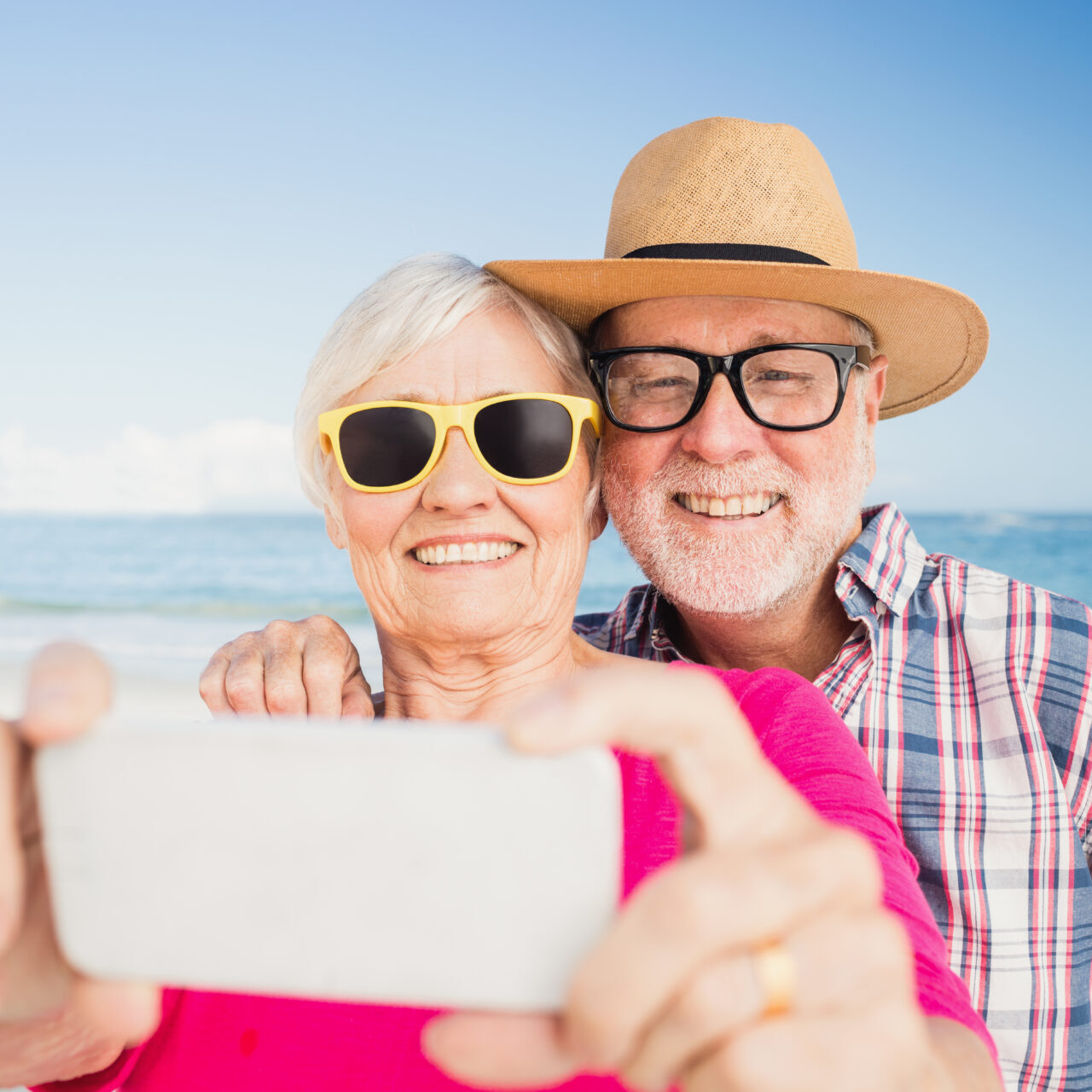 Senior,Couple,Taking,Selfie,On,The,Beach